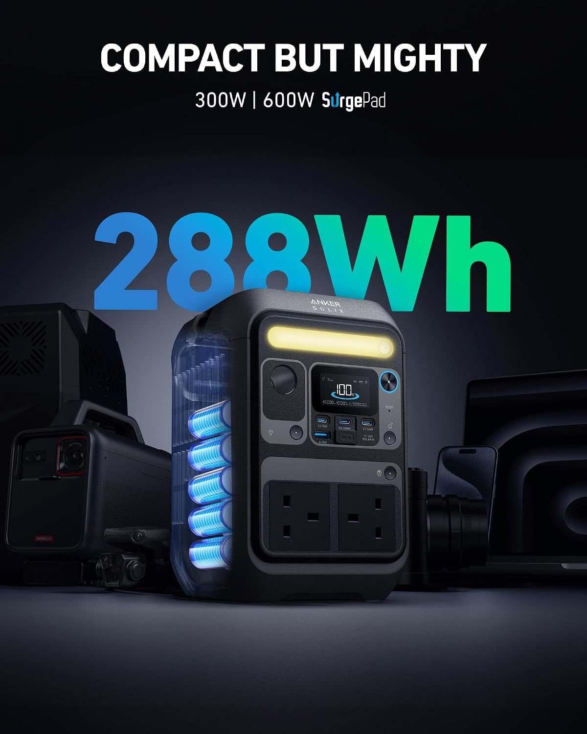Anker SOLIX C300X portable power station on a camping table, with a laptop plugged in.
