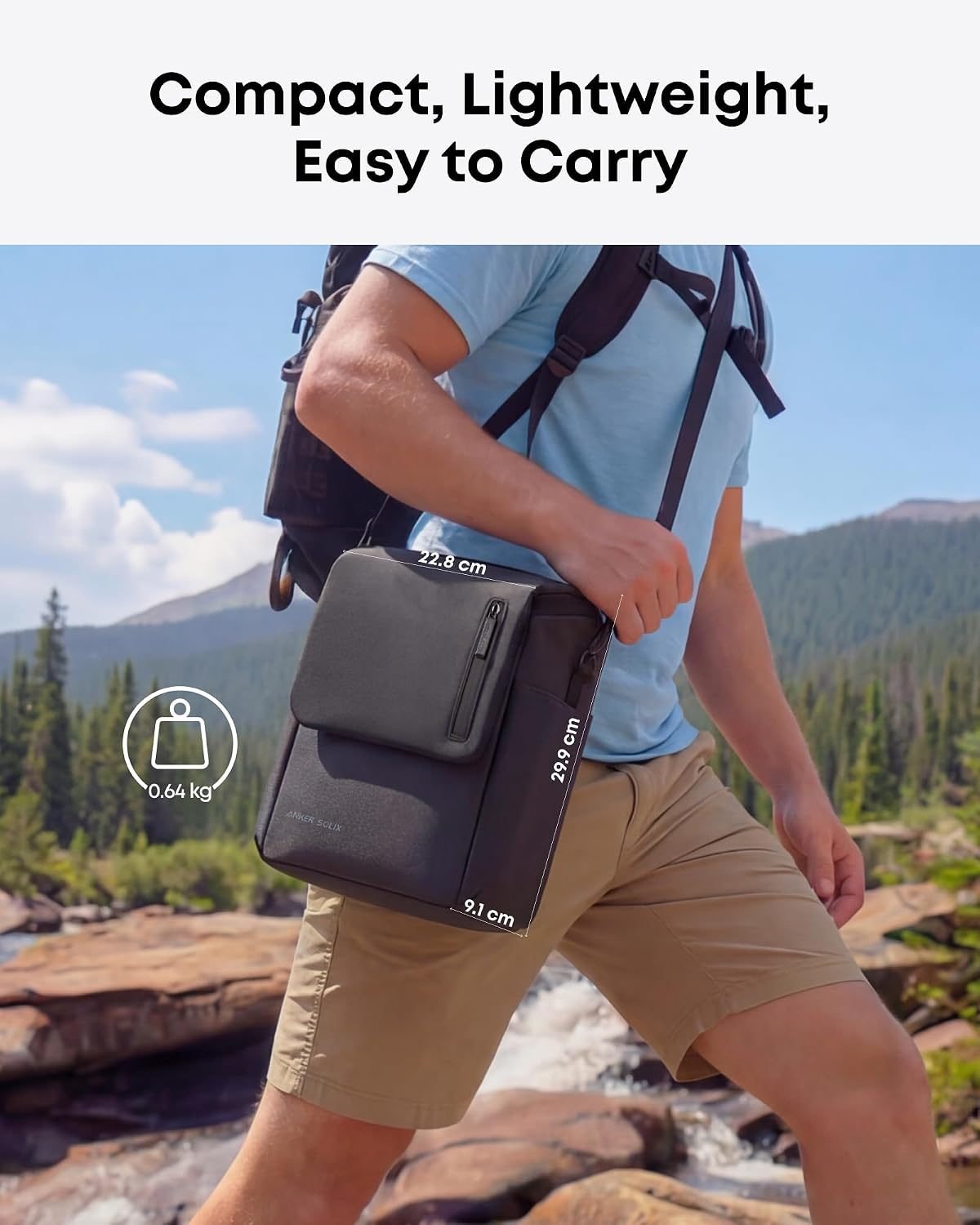 Anker SOLIX C300X portable power station on a picnic blanket, charging a laptop outdoors.